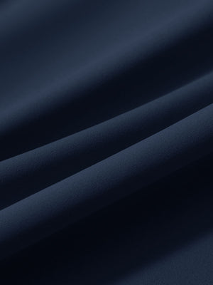 Close-up texture of navy women's lightweight athletic sweatpants fabric showing weave detail.