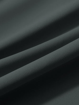 Close-up texture of dark grey women's lightweight athletic sweatpants fabric showing weave detail.