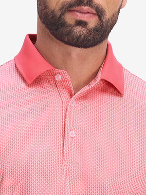 Front shot from nose to chest of model wearing brick red moisture wicking jacquard golf shirts