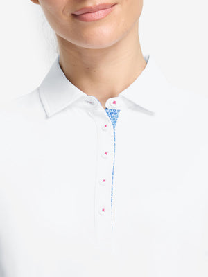 Front shot from nose to chest of model wearing white women's 5 buttons collared polo shirts