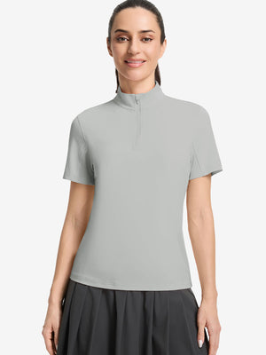 Front upper body shot of model wearing light grey women's breathable 1/4 zip pullover golf shirts
