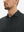 Front view from nose to chest of model wearing rich black grid  performance reflective checked collar golf shirt