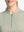 Front shot from nose to chest of model wearing moss green white women's q-zip pin striped texture golf shirts