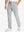 Front lower body shot of model wearing water-resistant stretch heat-tech winter trousers in light grey