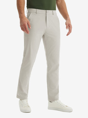 Front lower-body view of model in light khaki stretch quick dry casual golf pants with 4 pockets