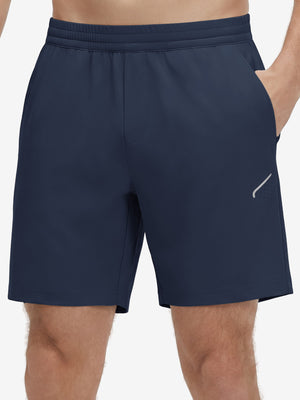 Front lower body shot of model wearing navy 4 way stretch breathable workout athletic shorts