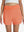 Front lower body shot of model wearing peach pink women's gym golf shorts with liner pocket