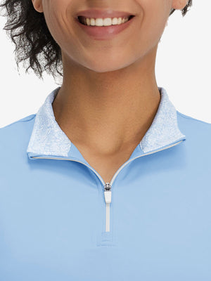 Front view from nose to chest of model wearing light blue women's athletic quarter zip tank tops