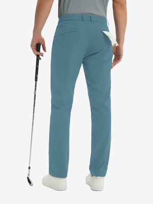 Rear lower-body: model in blue stretch quick dry casual golf pants with 4 pockets holding golf club in right hand.