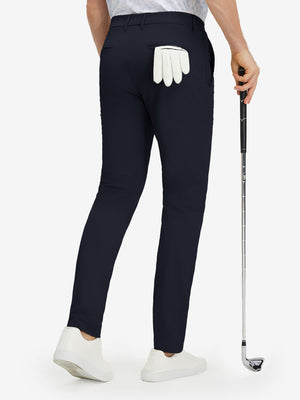 Back lower body shot of model wearing navy stretch cotton blend slim fit golf trousers 5 pockets