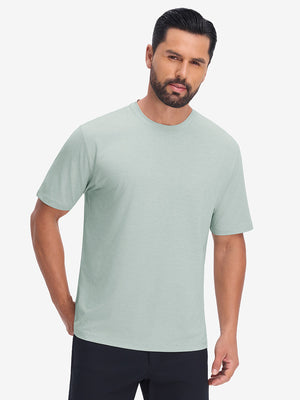 Front upper body view in light green heather of moisture wicking heather round neck athletic t-shirts.
