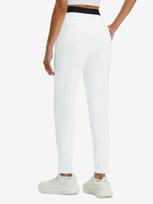 Back lower body shot of model wearing white women's lightweight athletic sweatpants