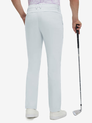 Back lower body shot of model wearing newport blue straight fit lightweight dress golf pants