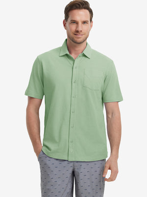 Model half-body front view wearing light green cotton blend plain shirt.