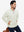 Model with both hands in pockets, wearing soft winter fleece jackets in beige, warm and relaxed.