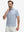 Front waist-up shot of model wearing white navy dolphin performance quick dry print golf polos