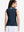 Back upper body shot of model wearing navy women's collared v neck quick dry tank tops