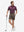 Front full body shot of model wearing tobacco brown flat front hybrid golf shorts
