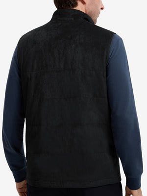 Back upper body shot of model wearing black  classic micro suede leather puffer vest