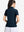 Back upper body shot of model wearing navy women's 5 buttons collared polo shirts