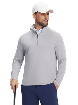 Front upper body view of model holding a golf club in light grey two tone pique cotton blend q-zip