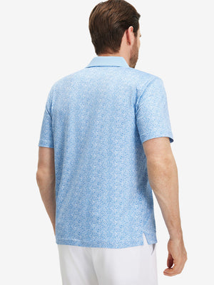Back upper body shot of model wearing blue white abstract maze premium ribbed collar print polo shirts