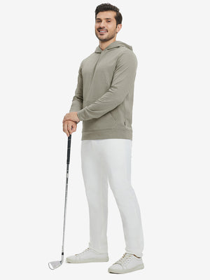 Model full-body view holding a golf club wearing warm fleece golf hoodies pullover in dust beige.