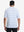 Back upper body shot of model wearing white/cabana swim heather non-curl ribbed collar striped polo shirts