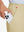 Hand placing an iPhone into pocket of lightweight flat front casual trousers in khaki.
