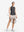 Front full body shot of model exercising in light and dark grey women's q-zip pin striped texture golf shirts