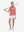 Front full body with golf club in pink of women's 4 buttons golf polo shirts.