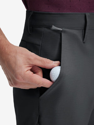 Detail view of front pocket on iron grey flat front hybrid golf shorts