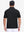 Back upper body shot of model wearing black dry fit waffle textured collared golf shirts