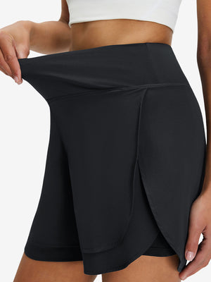 Detail view of elastic waistband on black women's gym golf shorts with liner pocket