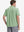 Model half-body back view wearing light green cotton blend plain shirt.