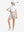 Front full body shot of model exercising in white women's breathable 1/4 zip pullover golf shirts