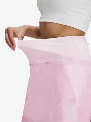 Detail view of elastic waistband on light pink women's stretch a-line golf skort with 7 pockets