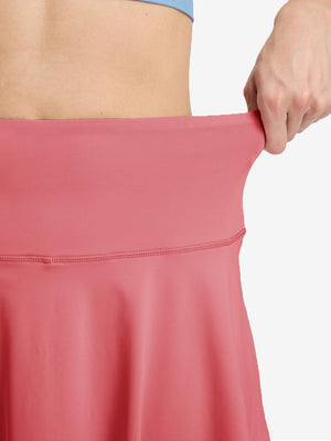 Detail view of skirt elasticity on pink women's high waisted golf skirts with 4 inner pockets