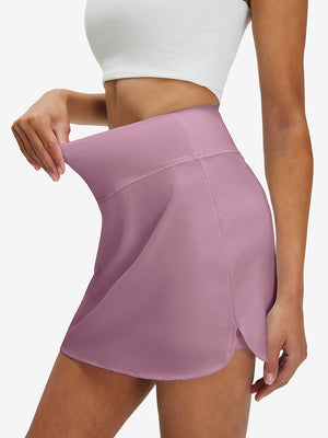 Detail view of elastic waistband on lavender pink high waist built-in short a-line golf skirt with 5 pockets