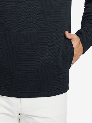 Close-up of pocket detail, single hand inside texture solid hoodies pullover, casual style in navy.