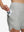 Side view of pocket on glacier grey women's high waist 2 in 1 quick dry shorts with 7 pockets