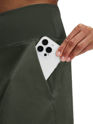 Detail view of side pocket on army green women's stretch a-line golf skort with 7 pockets
