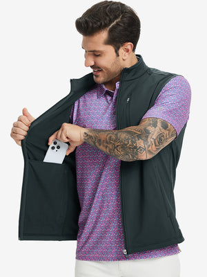 Close-up of water-resistant fleece golf vests pocket holding a phone, practical detail in dark grey