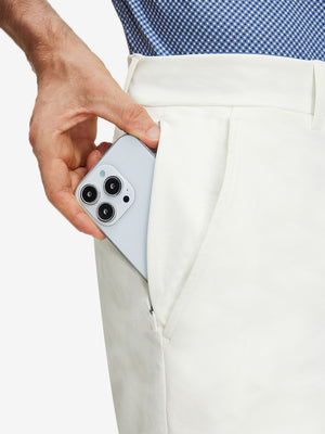 Detail view of inner front pocket on white flat front flex cotton blend golf shorts