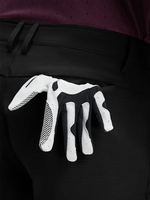 Detail view of back pocket on dark charcoal flat front hybrid golf shorts