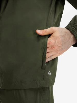Detail view of outer pocket on army green waterproof lightweight rain jacket with hood