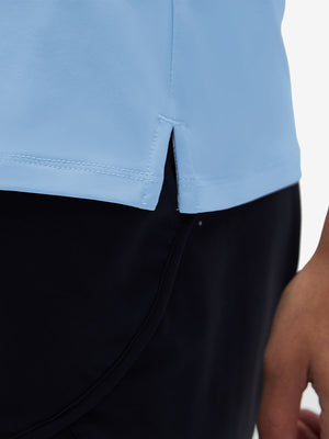 Detail view of hem on light blue women's athletic quarter zip tank tops