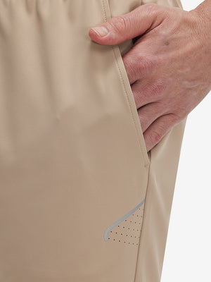 Side view of pocket on light khaki 4 way stretch breathable workout athletic shorts