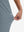 View showing loose fit of grey blue women's high waist stretch golf pants with pockets