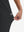 View showing loose fit of black women's high waist stretch golf pants with pockets